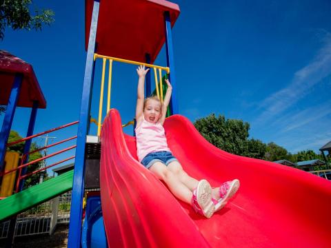 BIG4 Shepparton Park Lane Holiday Park - Outdoor Playground - Girl on Slide